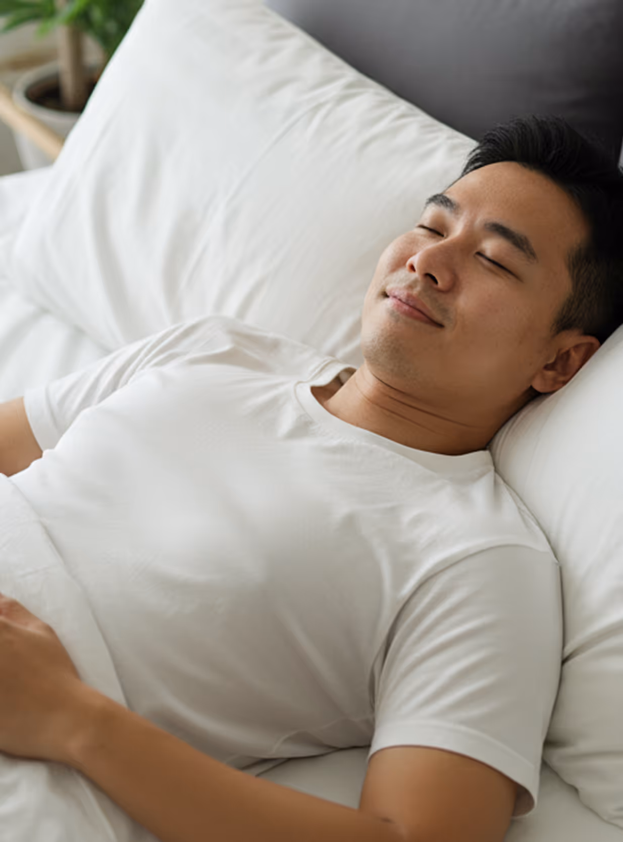 A young Singaporean male sleeping